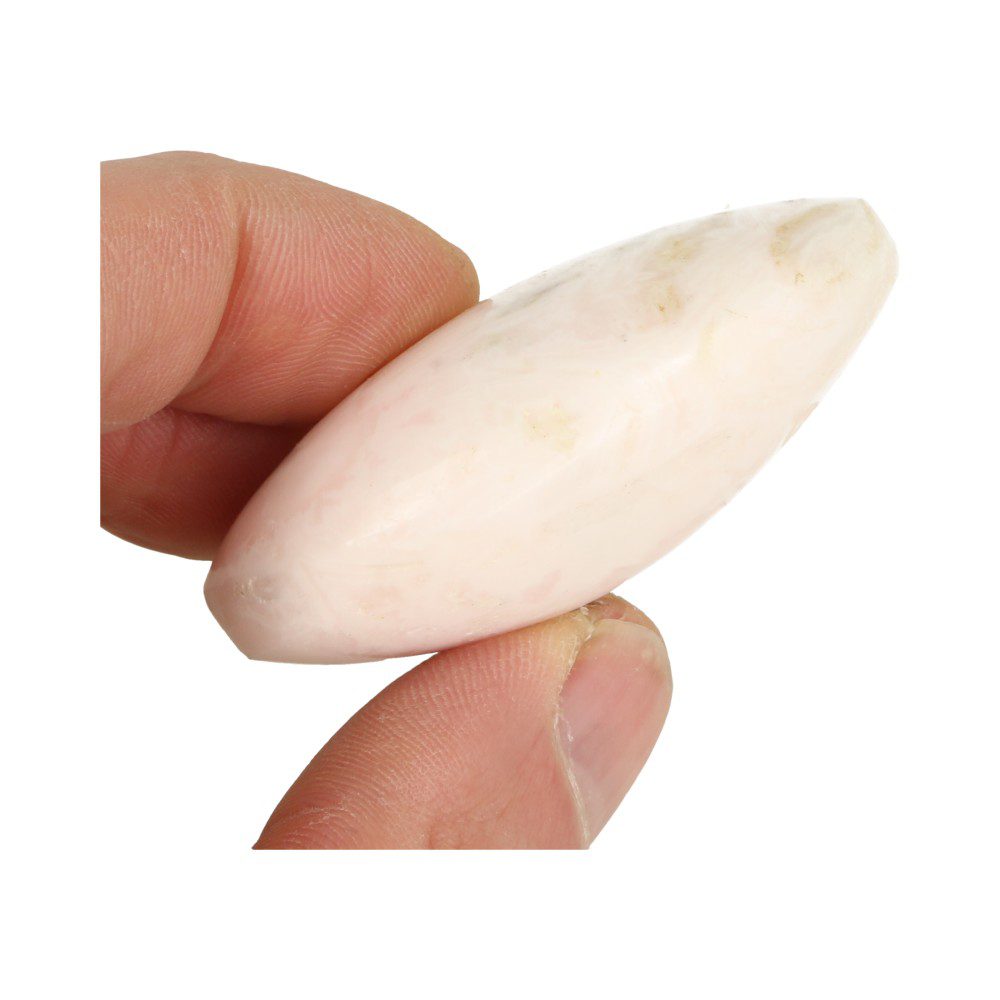Zij-aanzicht in hand van Helder roze mangano calciet knuffelsteen in A-kwaliteit en lengte van 6cm uit Peru