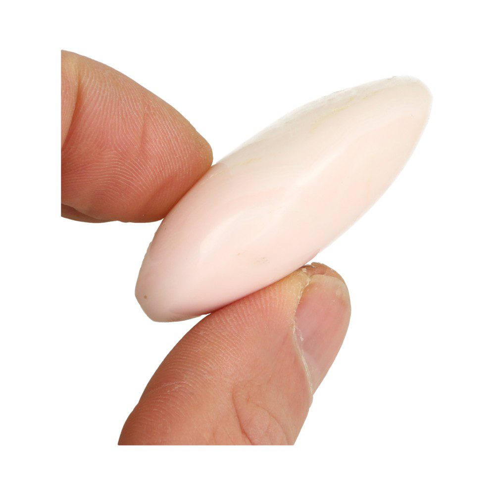 Zij-aanzicht van Fijn formaatje A-kwaliteit mangano calciet knuffelsteen van 5cm lang uit Peru