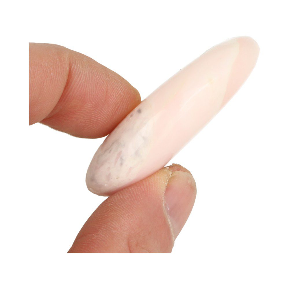 Zijkant van Heerlijk heldere roze mangano calciet handsteen die lekker plat is
