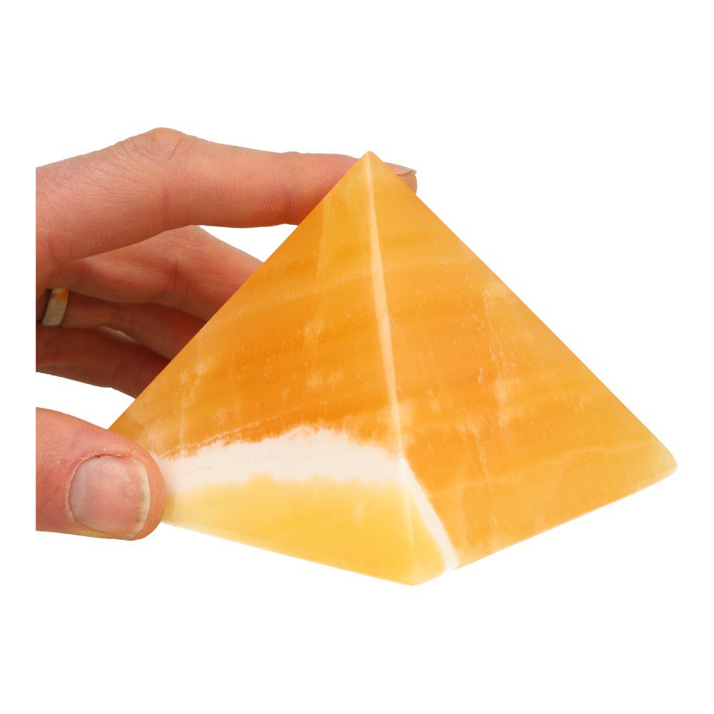 Fraaie oranje calciet piramide van 10cm breed - in hand