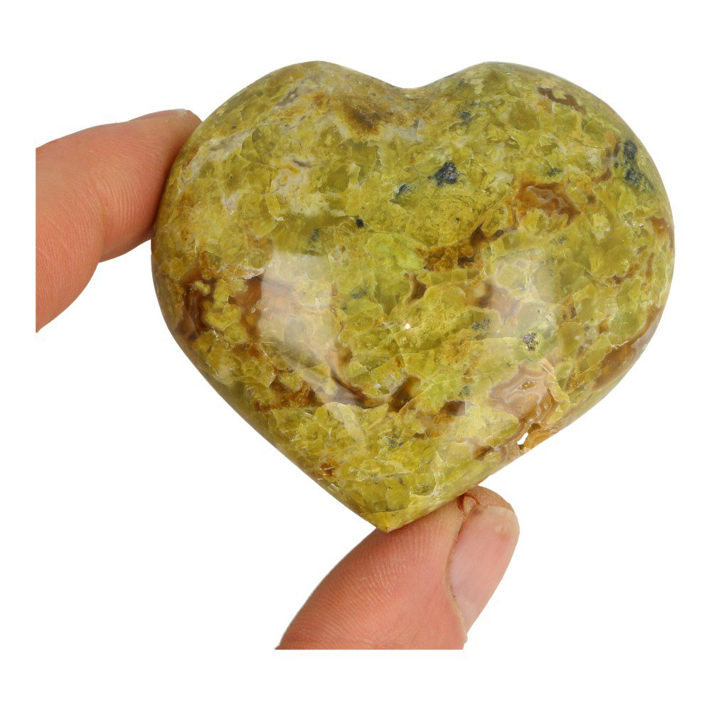 Overzchtsfoto in hand van fraai zacht-groene opaal hart van 7cm breed en natuurlijke holtes uit Madagaskar