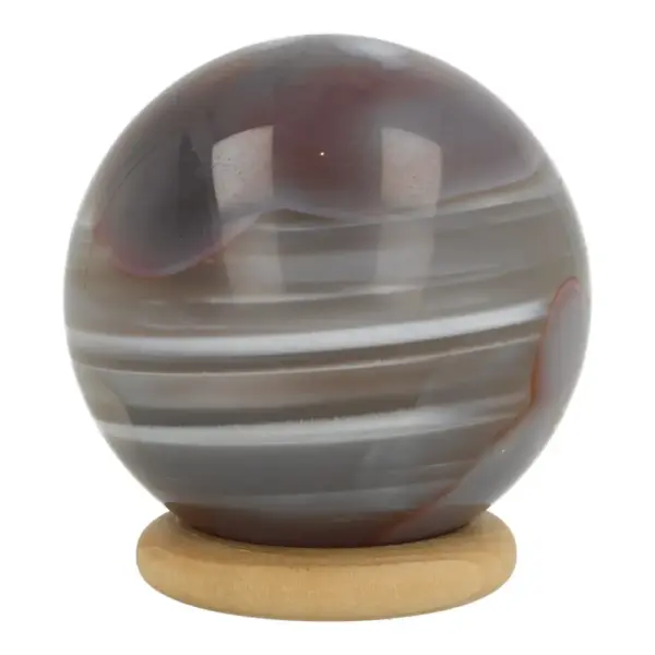 Botswana agaat bol met diameter van 46mm op houten ring met mooi lijnenspel en kleurverloop