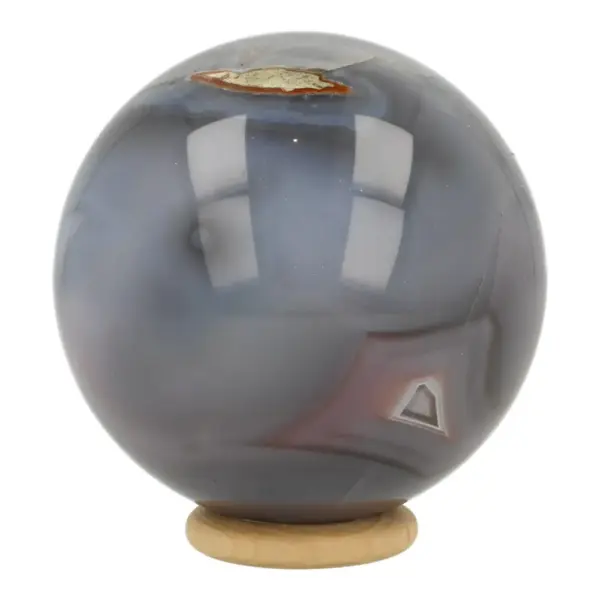 Mooie Botswana agaat bol met diameter van 70mm op houten ring