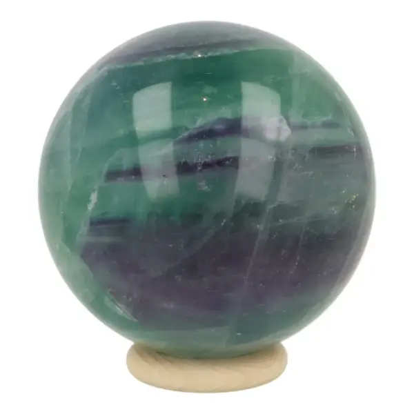 Zeer fraaie fluoriet bol met diameter van 60mm op houten ring